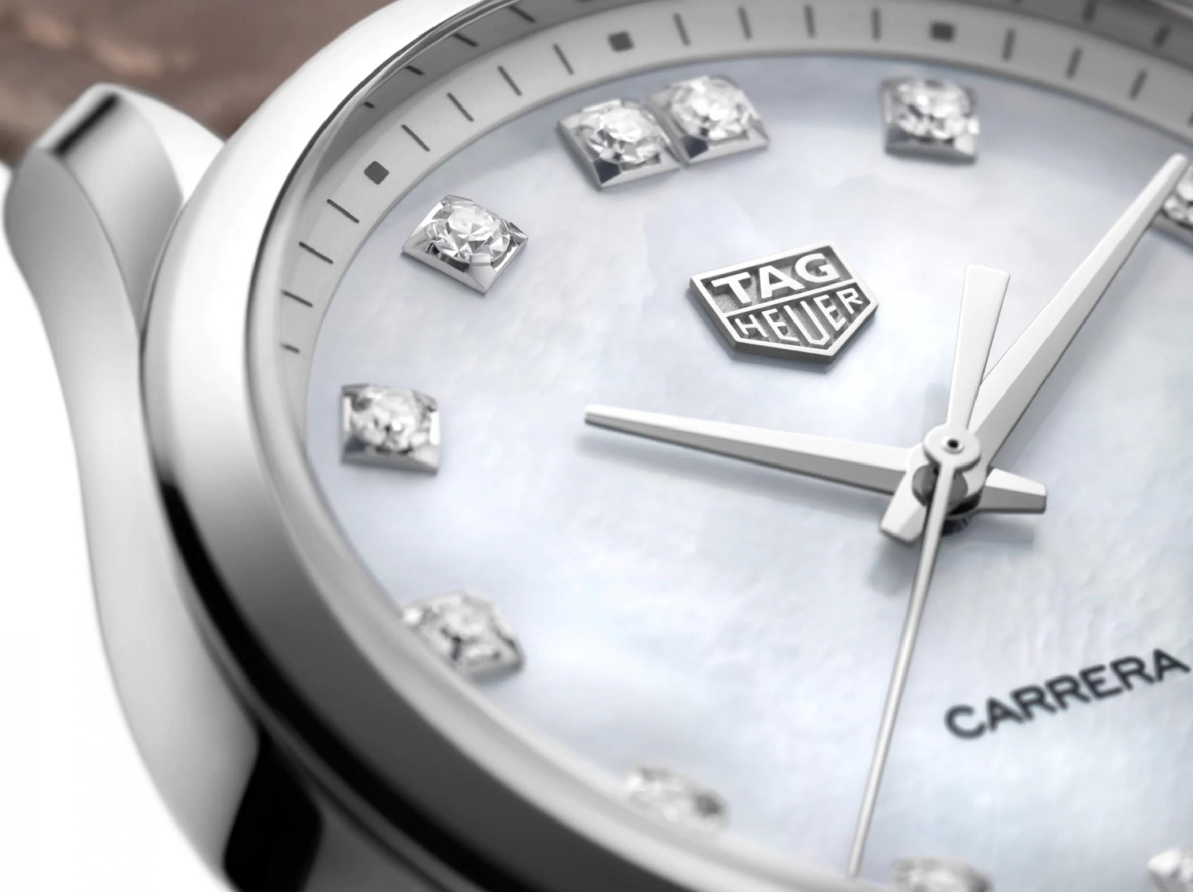 The white mother-of-pearl dial fake watch has diamond hour marks.