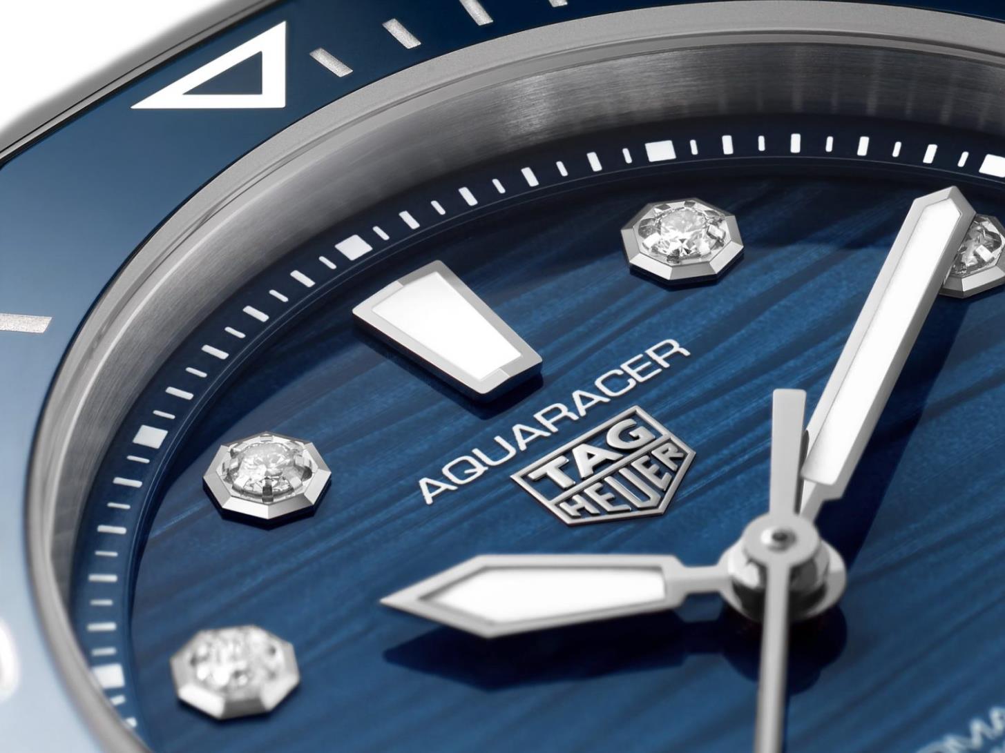 The blue dial fake watch has diamond hour marks.